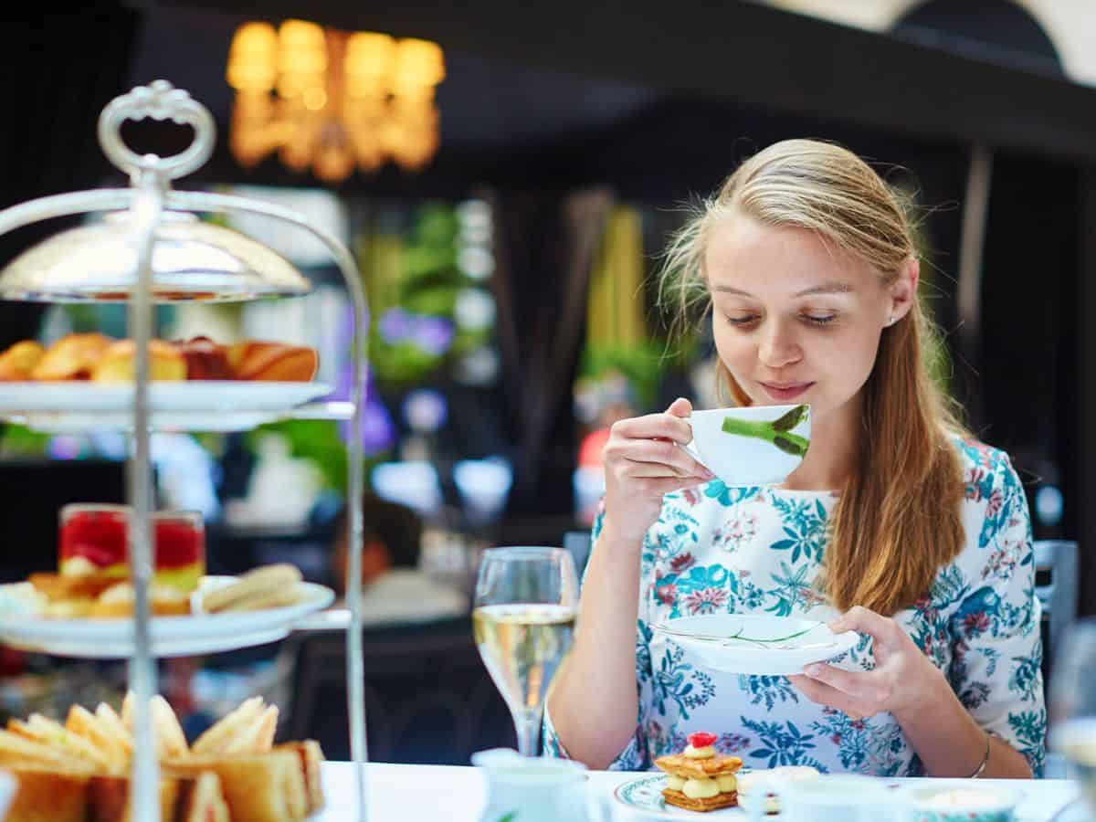 A woman enjoying afternoon tea.