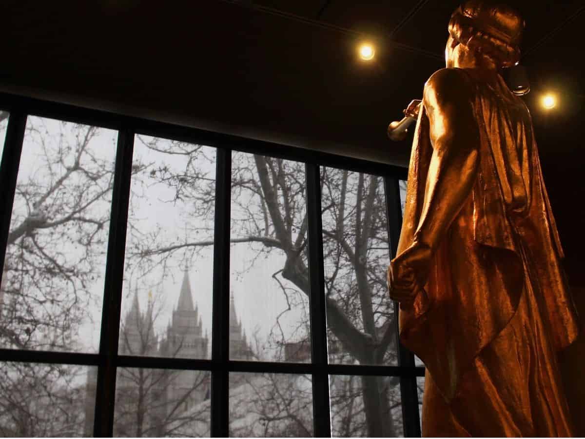 A statue of angel Moroni gazing out of a window at the Salt Lake City temple in Utah.