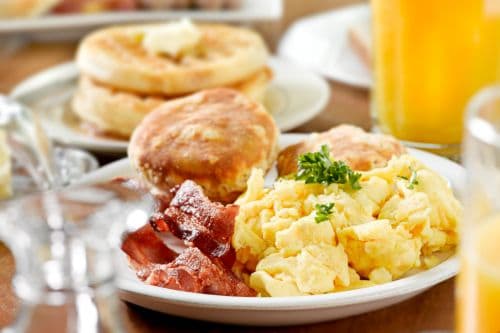 Table full of breakfast dishes