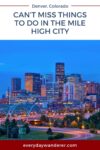 Denver city skyline at dusk with illuminated buildings and bridges.