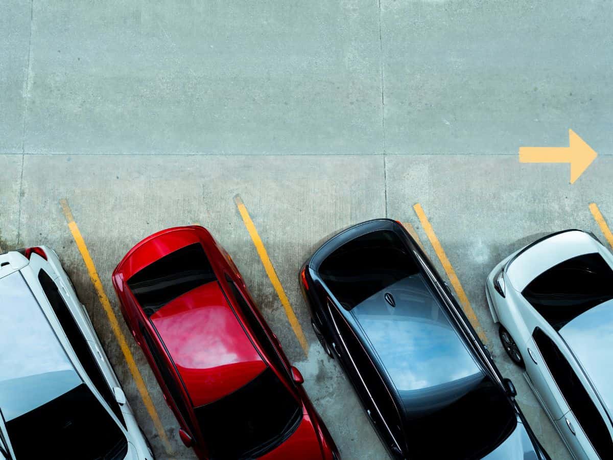 A fleet of cars parked in a parking lot near the Mall of America.