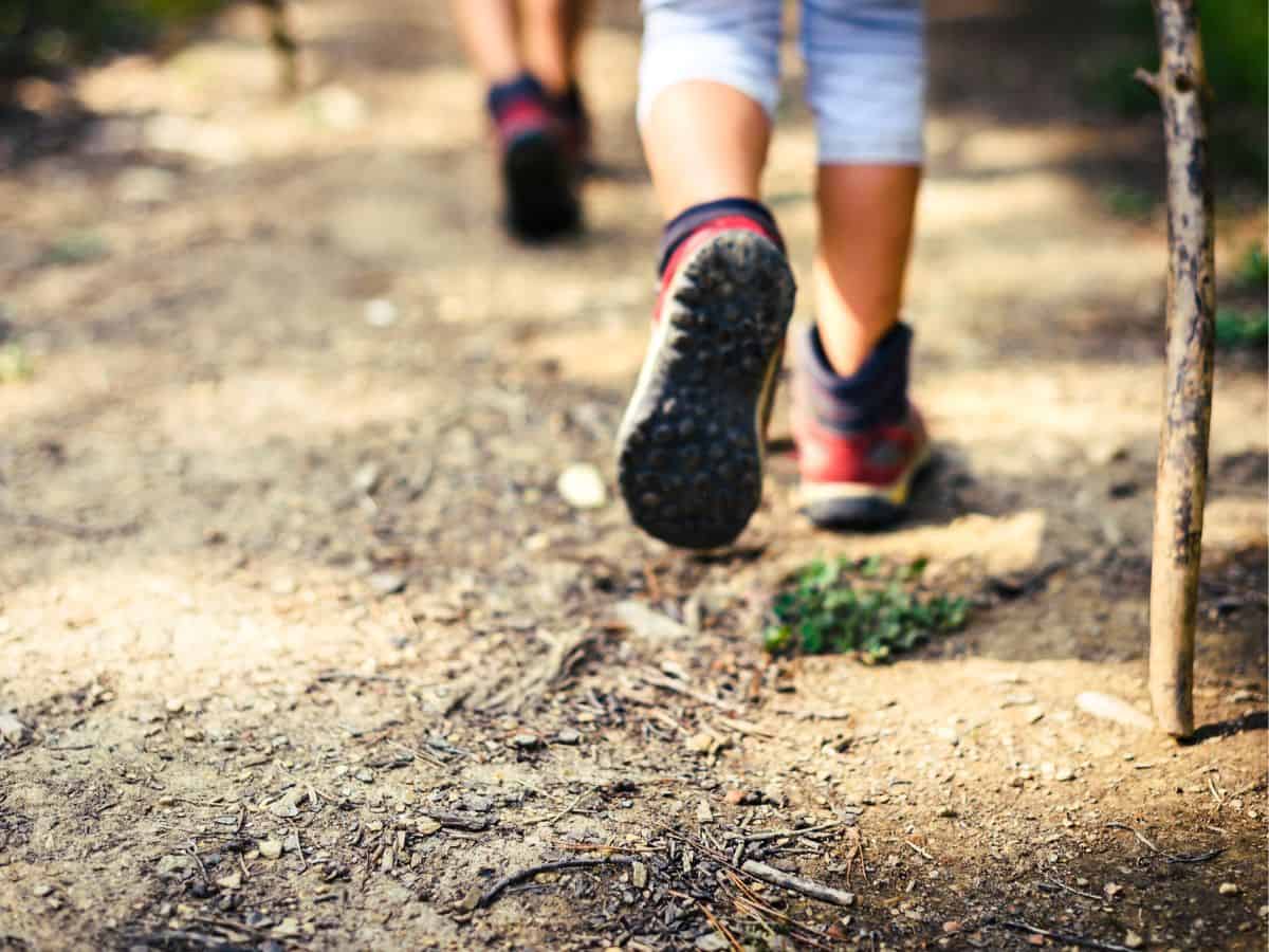 Couple Hiking on a Dirt Trail