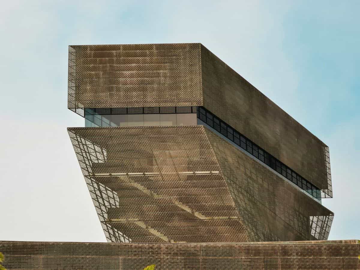 A building with a metal structure on top of it.