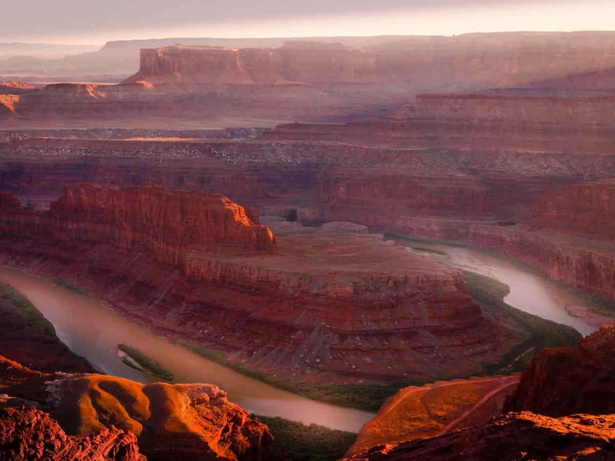 A river runs through a red rock canyon at Dead Horse National Park in Moab, Utah.