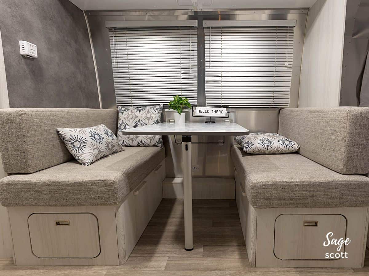 The dining table in an Airstream Bambi converts into additional sleeping space.