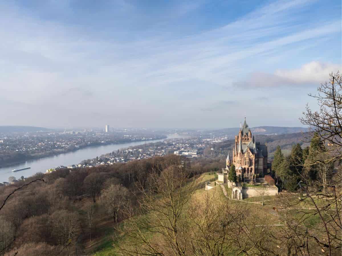 A grand German castle overlooking a river in Germany.