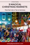 People browsing stalls at a festive outdoor Christmas market decorated with lights and garlands.