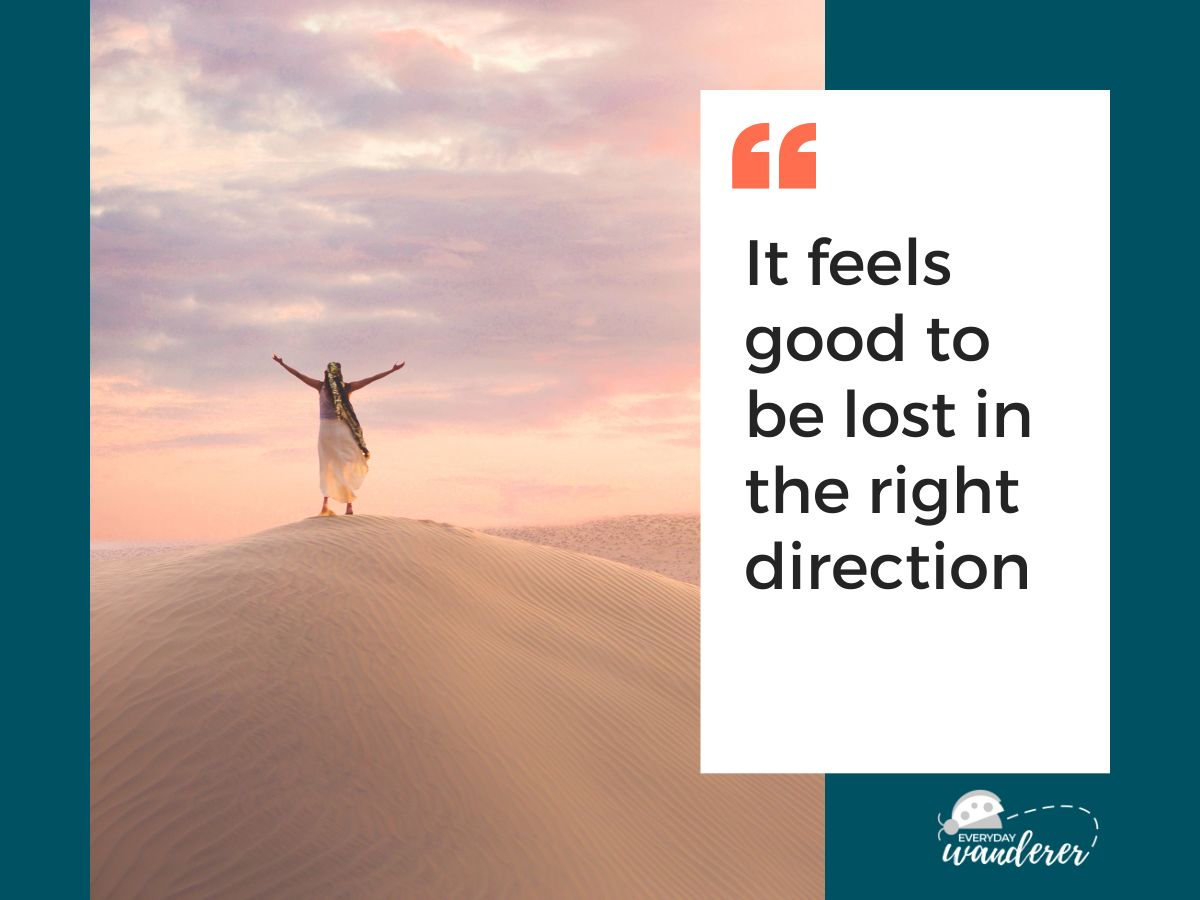 A person stands on a sand dune with arms raised against a pastel sky, accompanied by an inspirational quote..