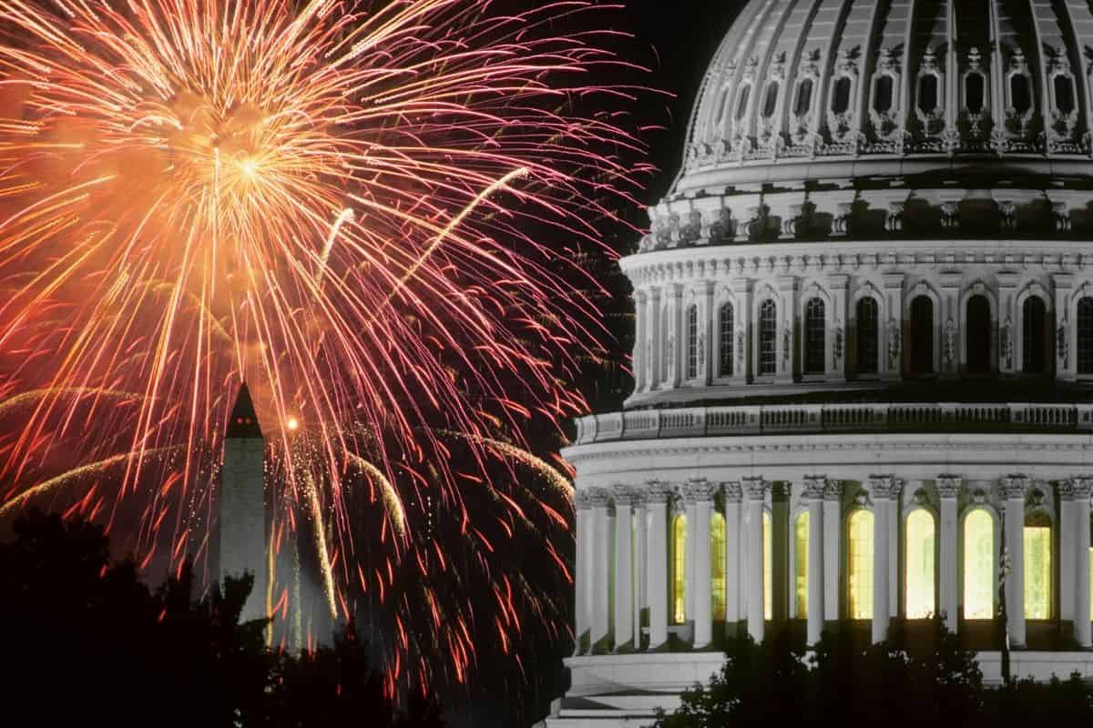 Fireworks illuminate the national mall as they explode over the capitol building in Washington, DC.