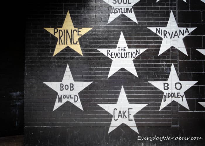 A gold star with Prince's name written inside on a black brick wall outside the First Avenue nightclub in downtown Minneapolis.