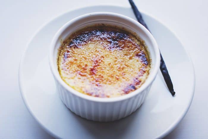 A white ramekin of creme brulee