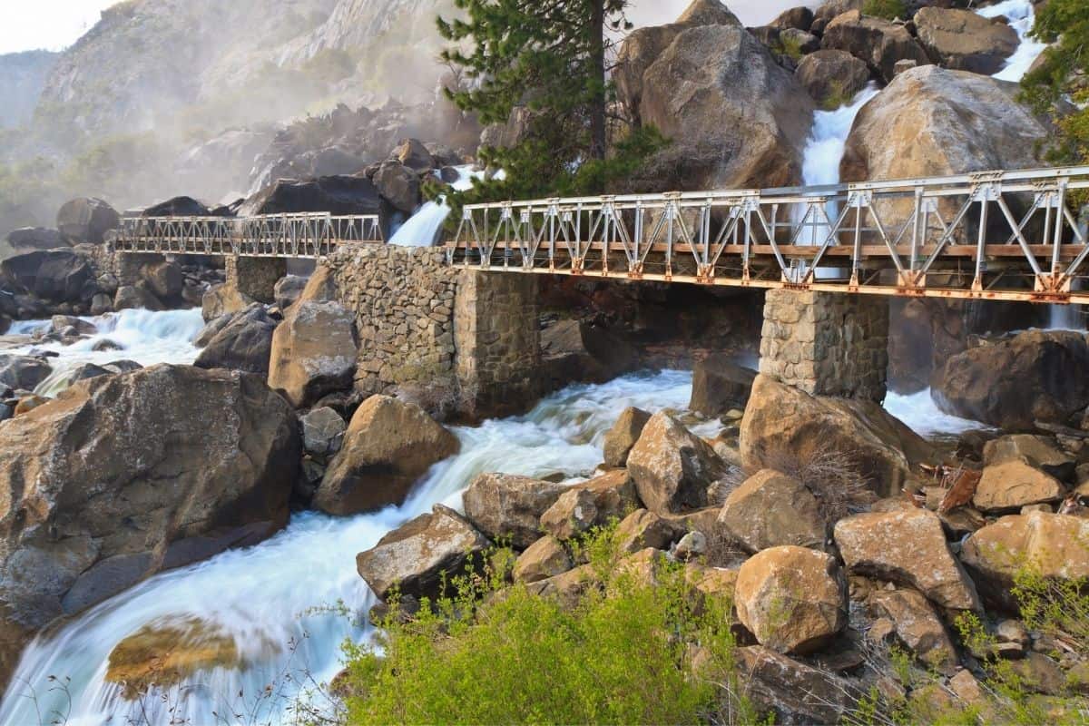 Wapama Falls flowing under a footbridge at Yosemite National Park.