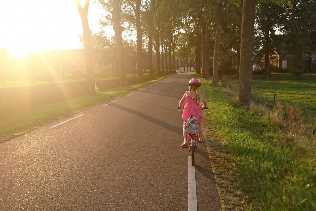 Girl Riding Bike on Street