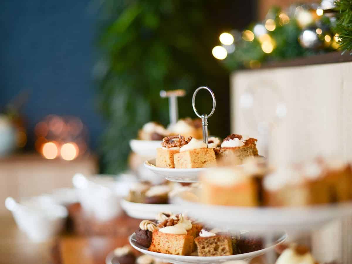 A table with a variety of teatime treats on it.