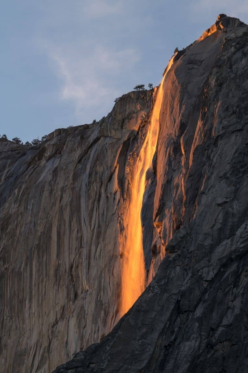Horsetail Fall glows an orange color during Firefall when the setting sun illuminates this Yosemite waterfall.