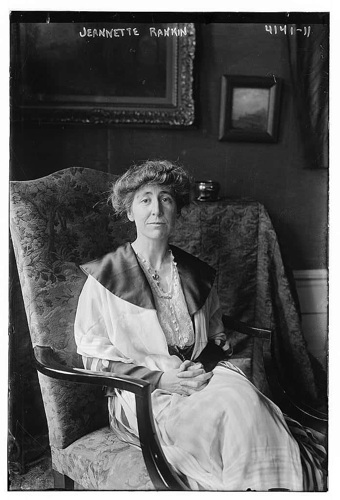 An old photograph featuring a woman sitting in a chair, capturing the essence of Montana's captivating history.