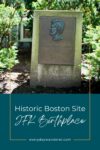 Bronze plaque commemorating john f. kennedy's birthplace, surrounded by greenery.