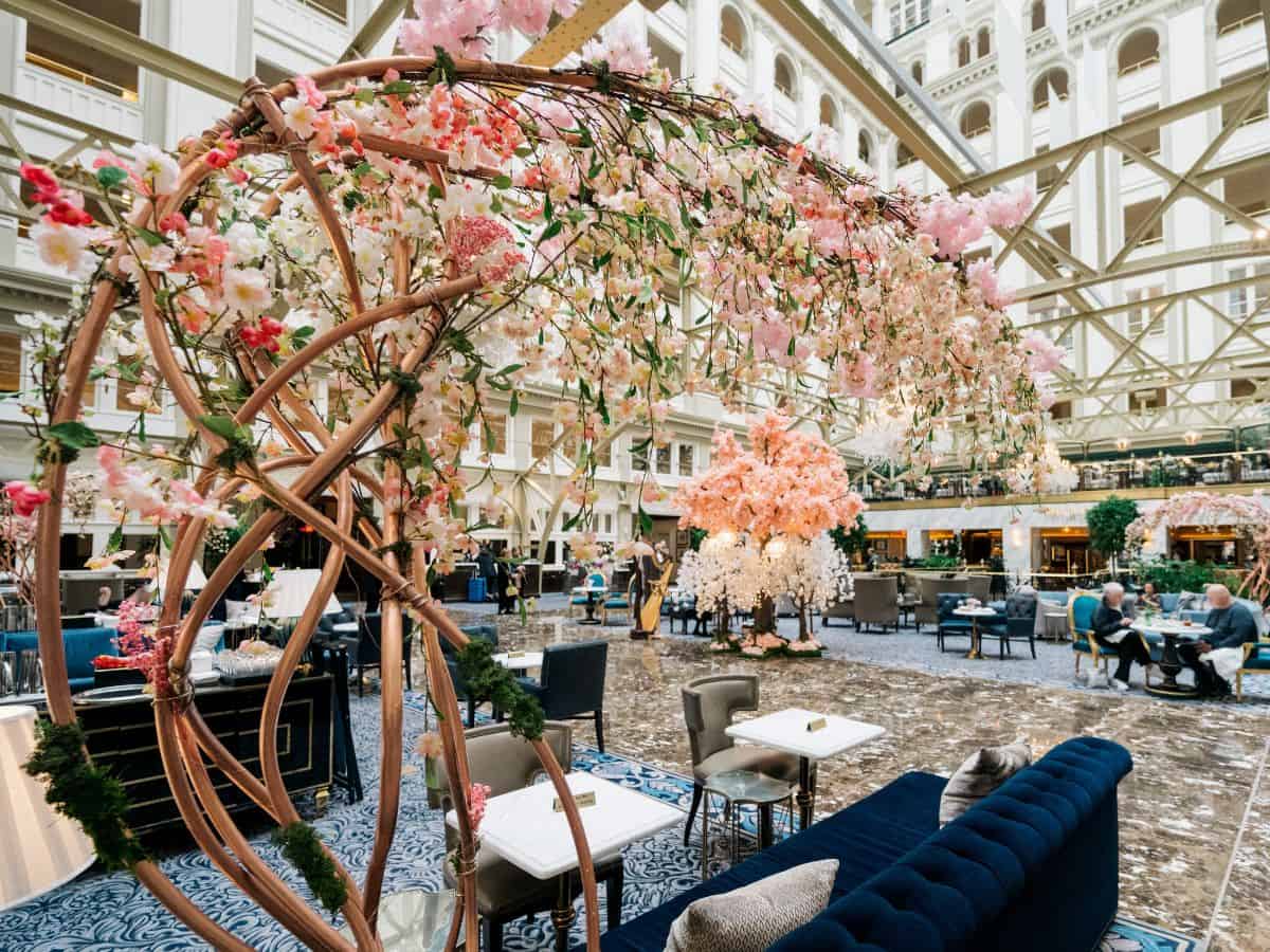 The lobby of the Waldorf Astoria Washington DC decorated with cherry blossoms.