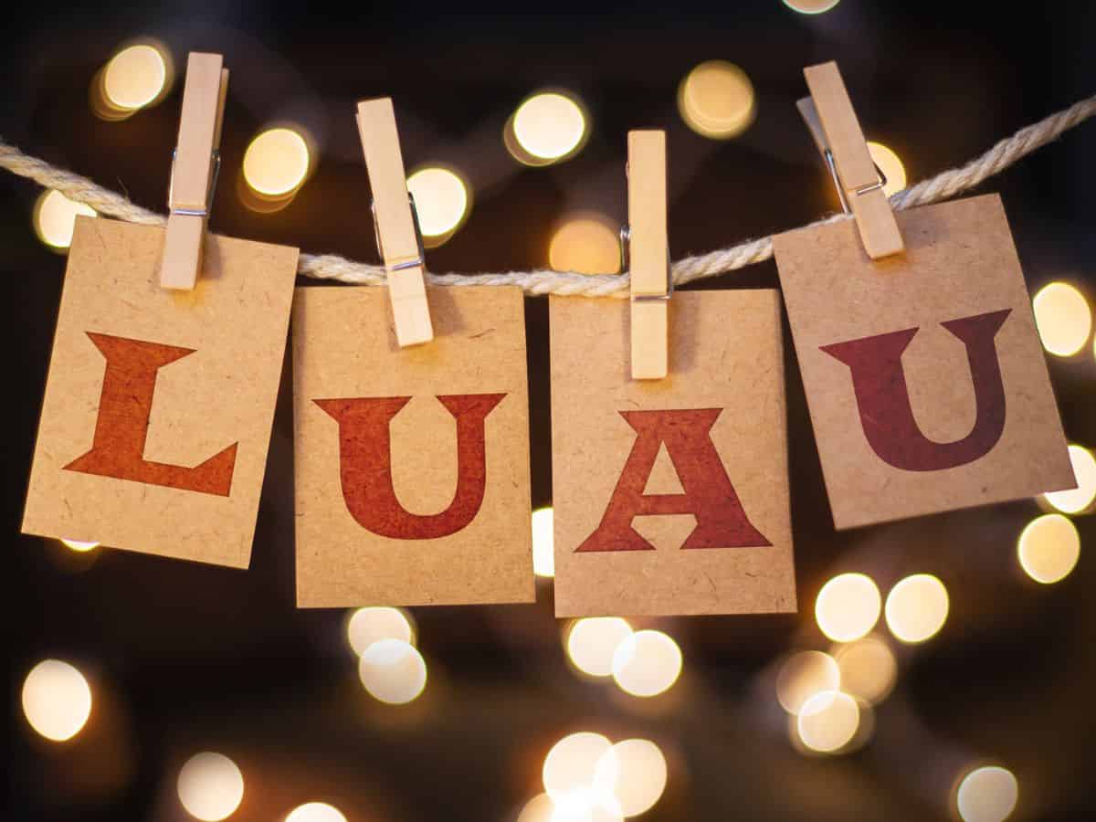 A sign welcoming guests to a Hawaiian luau.