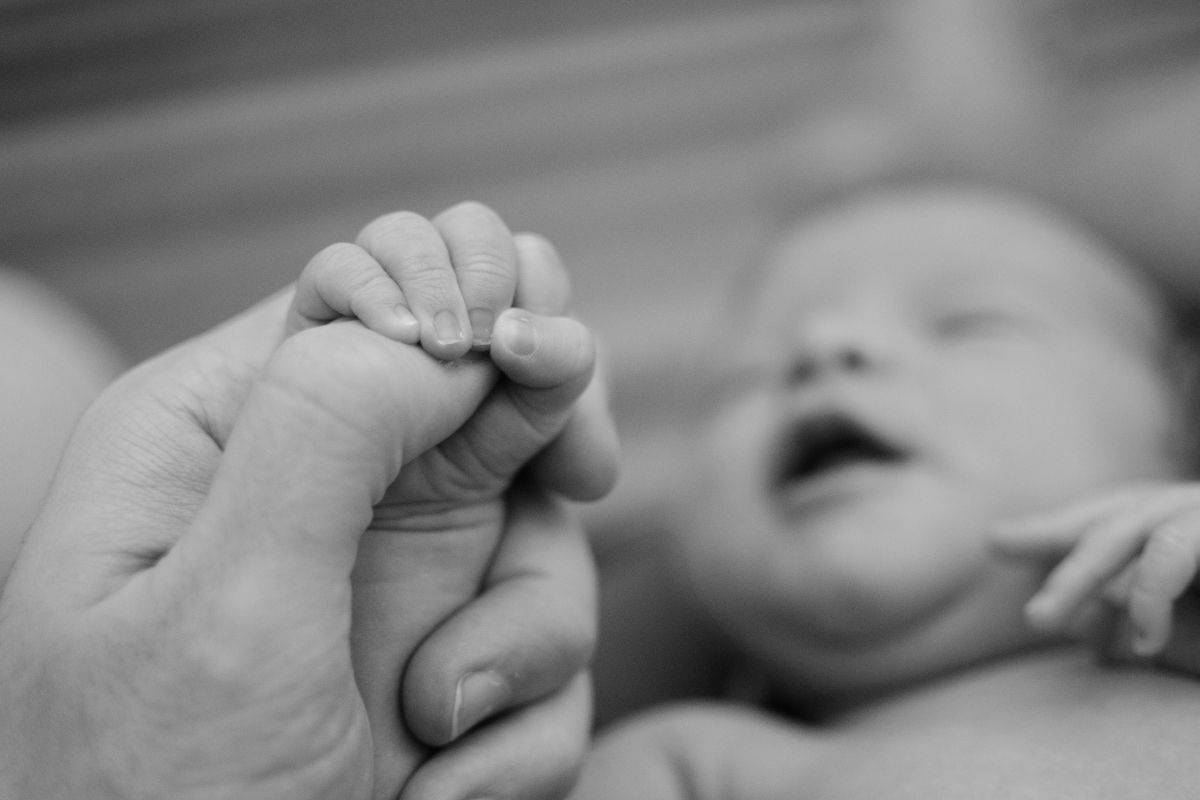 Black and white photo of a newborn baby