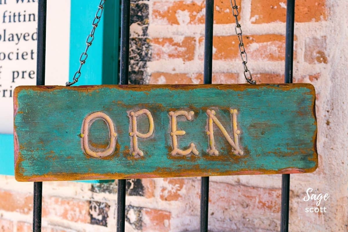 Turquoise and coral colored OPEN sign at a shop in Mesilla NM