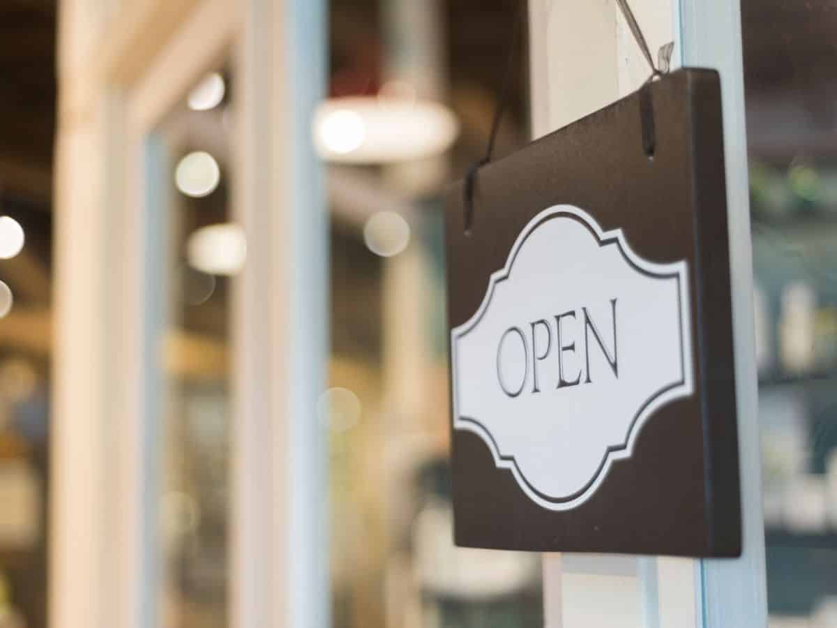 Open sign hanging in window
