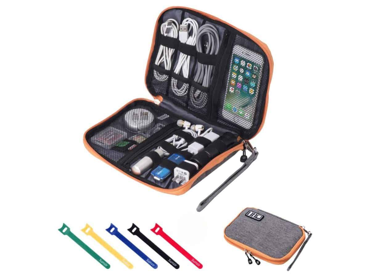 Orange and black cable and cord organizer filled with chargers and other electronics accessories.