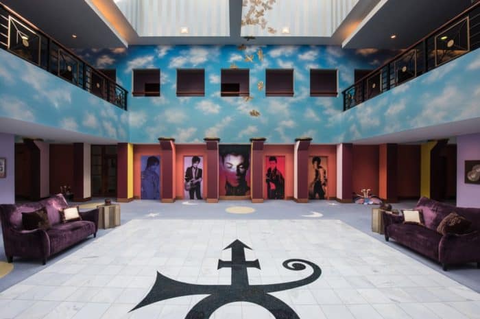 The atrium of Paisley Park features Prince’s love symbol embedded into the tile and painted doves flying toward the skylight.