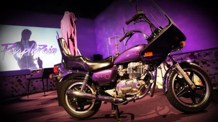 The Purple Rain exhibit at Paisley Park features Princes purple leather-bound script for the movie, his iconic purple jacked and ruffled shirt, and the motorcycle featured in the film.