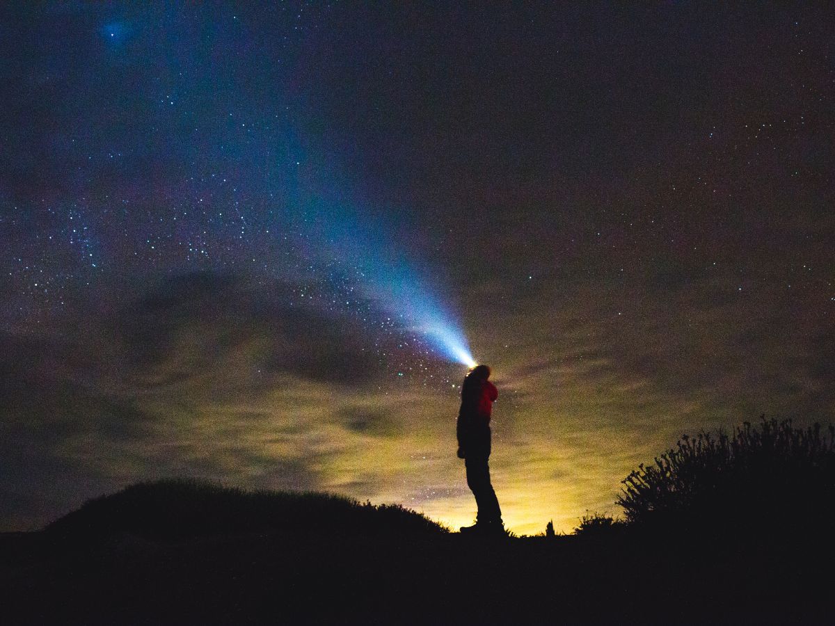 Person Looking Up at Starry Sky