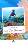 A snorkeler underwater near a coral reef giving two thumbs up. Text on image: "What is Reef Safe Sunscreen?.