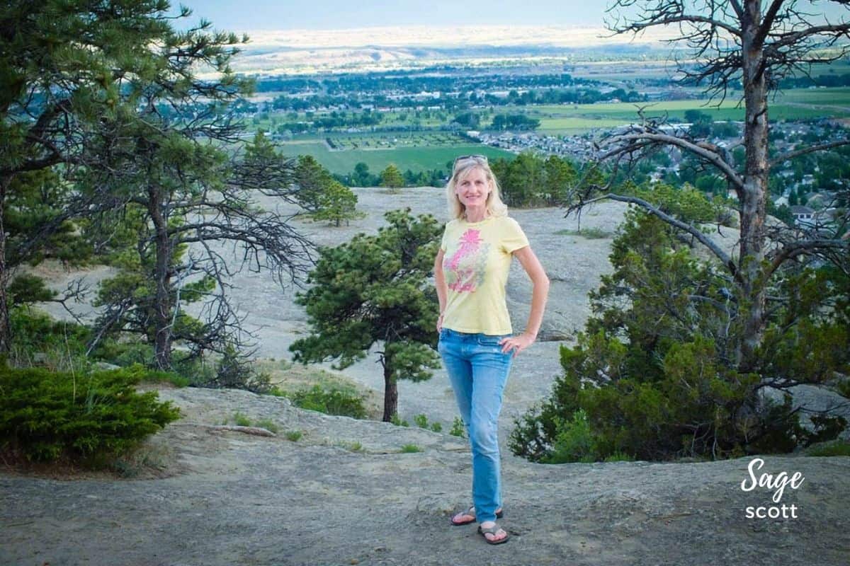 Sage Scott standing on a bluff in Zimmerman Park in Billings, MT.