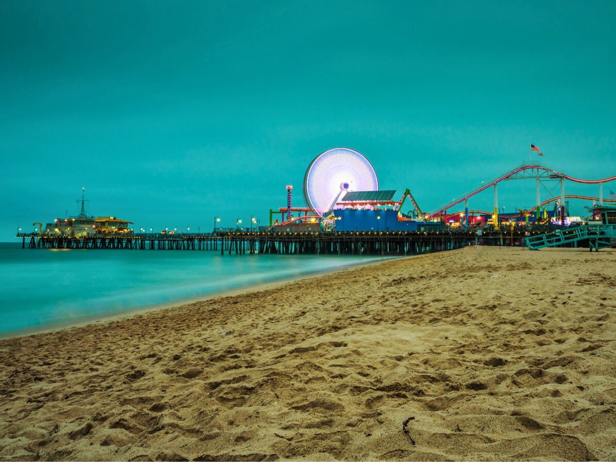 Santa Monica Pier at twilight, viewed from Santa Monica Beach.