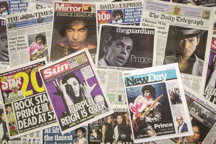 A collection of newspapers and magazines sharing the shocking news that Prince passed away.