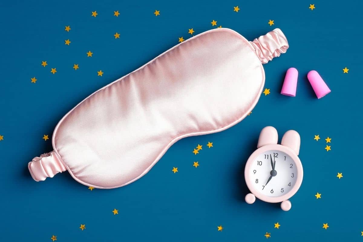 Pink sleep mask and ear plugs