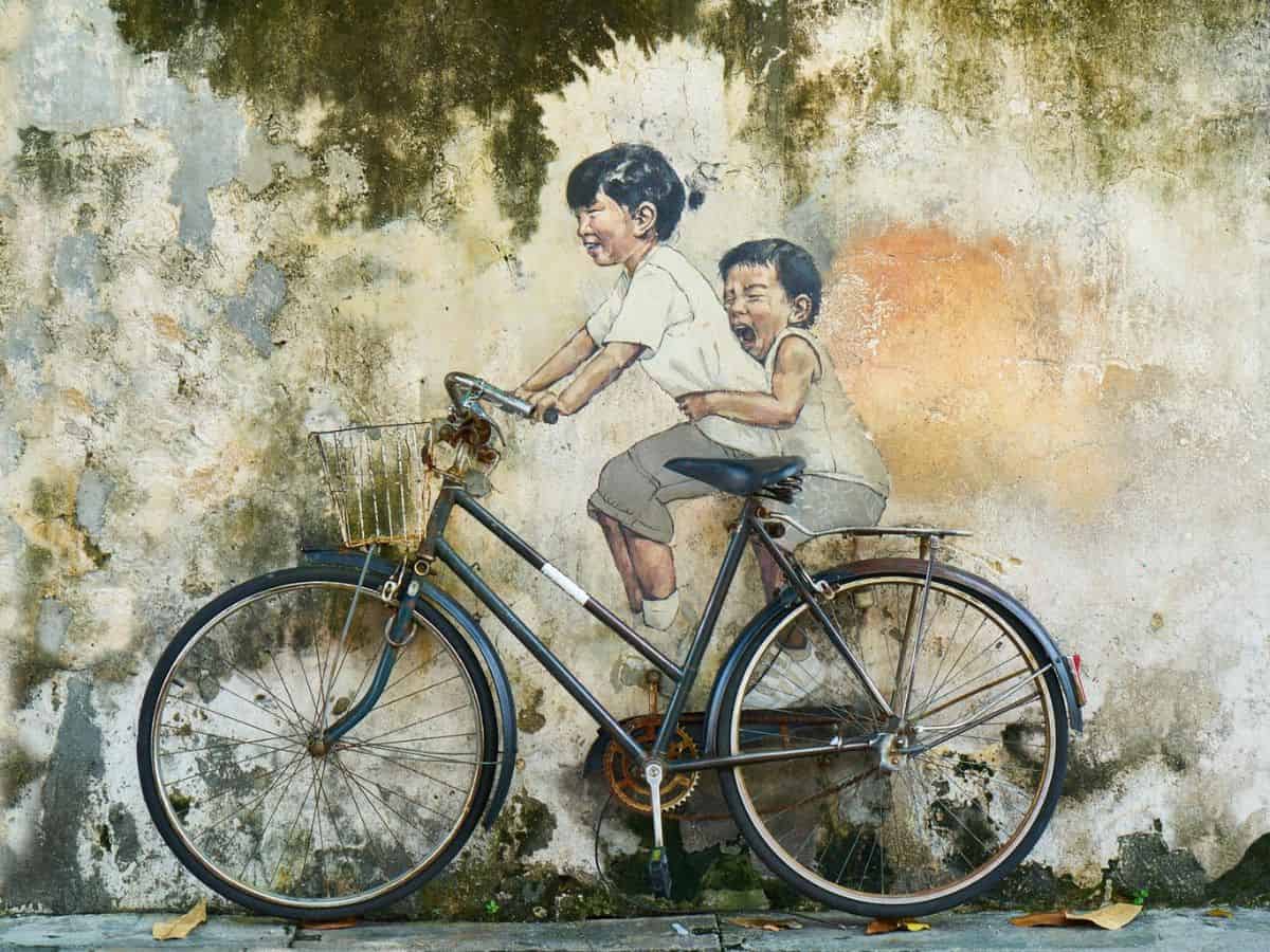 A scavenger hunt-inspired painting featuring a bicycle carrying two children.