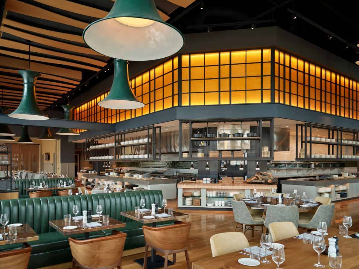 The interior of The Stilwell restaurant with tables and chairs.