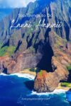 Aerial view of the rugged, green cliffs and blue ocean of Kauai, Hawaii, with text overlay about top things to do.