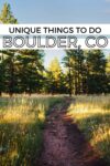 Pathway through a forest during daylight, with text overlay: "Unique Things to Do in Boulder, CO.