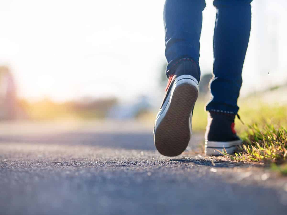 Person walking along a paved path