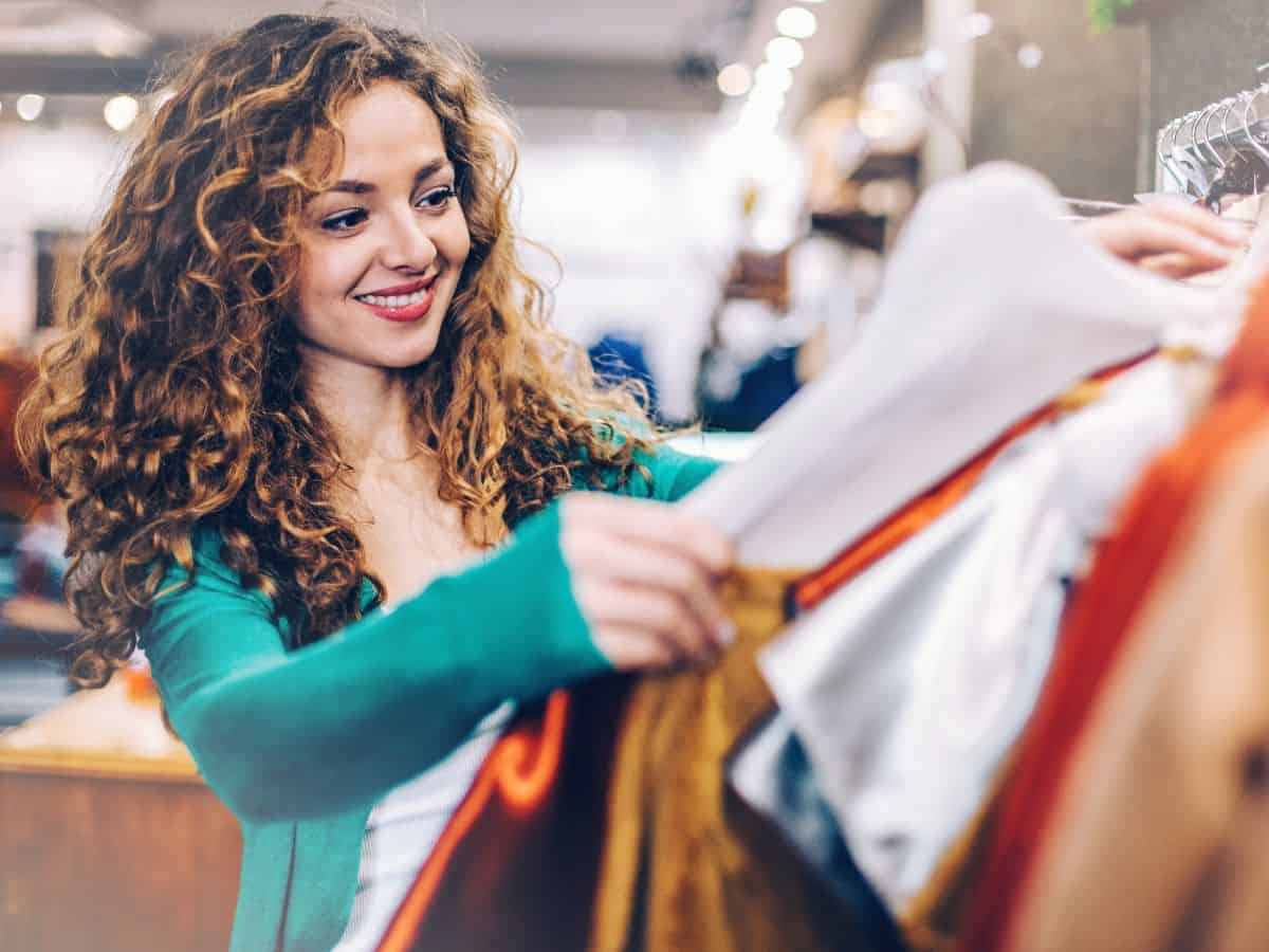 A woman exploring the vast collection of clothes in a clothing store at Mall of America, the largest mall in the United States.