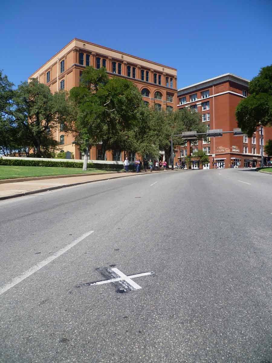 X mark on pavement outside the Sixth Floor Museum in Dallas TX