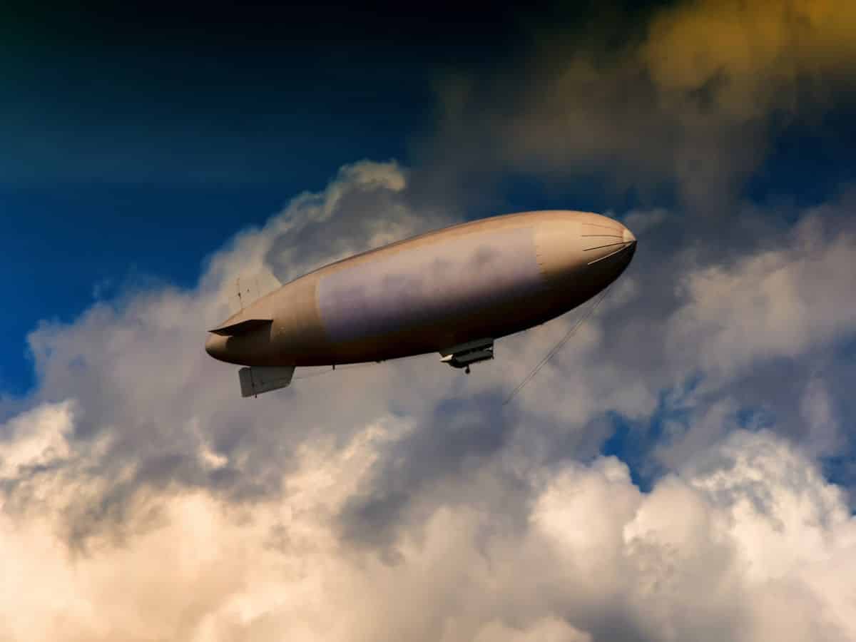 A zeppelin soaring through the clouds above Germany.